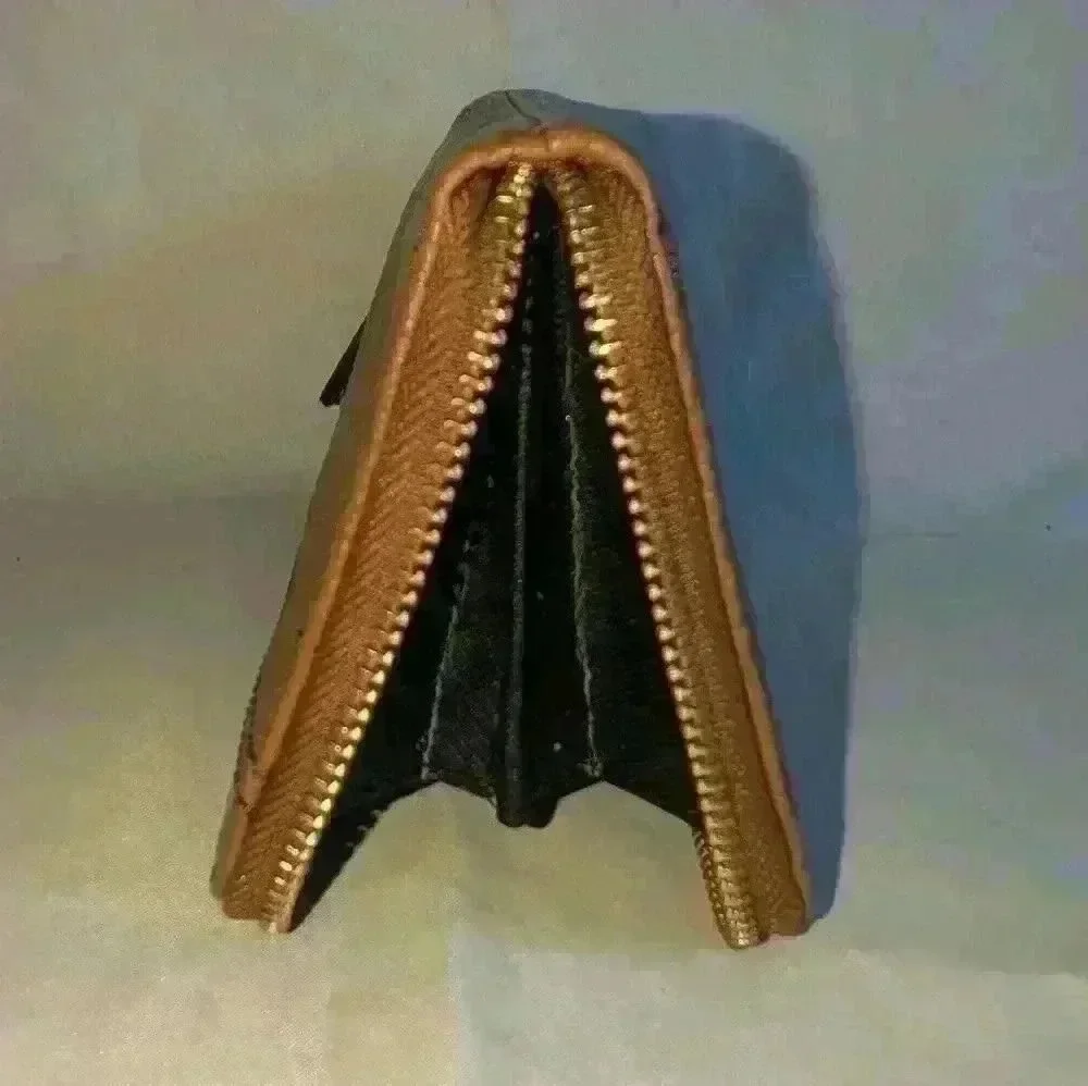 Brown Pebble Leather Fossil Zipper Wallet with Black Leathers Tassle